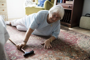 elderly woman on ground